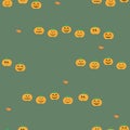 seamless pattern with contour orange pumpkin faces in a minimalistic style on a green background, background vector on halloween