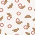 Seamless pattern with croissants and donuts covered with caramel and sprinkled with multi-colored crumbs on a beige background.