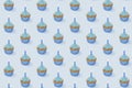 Seamless pattern with cupcakes with blue glaze on blue background, 3d rendering Royalty Free Stock Photo