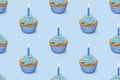 Seamless pattern with cupcakes with blue glaze on blue background, 3d rendering Royalty Free Stock Photo