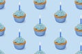 Seamless pattern with cupcakes with blue glaze on blue background, 3d rendering