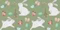Seamless pattern with cute Easter bunnies, Easter eggs and flowers on green background. Royalty Free Stock Photo