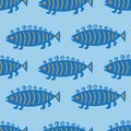 Seamless pattern with cute fishes on blue background. Royalty Free Stock Photo