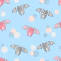 Seamless pattern with cute flying bats on blue Royalty Free Stock Photo