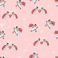 Seamless pattern with cute ladybugs. Cupid insect with an arrow and couple in love with heart on pink background. Vector Royalty Free Stock Photo