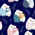 Seamless pattern with cute mom and baby owls. Childish owl birds and floral branches on dark blue background. Ideal for fabrics, Royalty Free Stock Photo