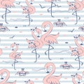 Seamless pattern with cute pink flamingos. Striped background. Vector Royalty Free Stock Photo