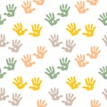Seamless pattern, cute prints of children\'s hands in pastel colors on a white background. Print, background, textile