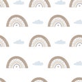 Seamless pattern with cute rainbows and clouds. Vector Illustration