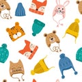 Seamless pattern with cute vector winter hats for boys and girls in cold weather. Clothes for winter and autumn. Vector Royalty Free Stock Photo