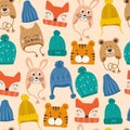 Seamless pattern with cute vector winter hats for boys and girls in cold weather. Clothes for winter and autumn. Vector Royalty Free Stock Photo
