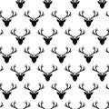Seamless pattern with deer heads silhouettes