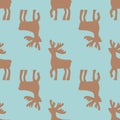 Seamless christmas Pattern of deers on blue background. Vector Background. Deer gold Silhouettes. Royalty Free Stock Photo