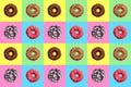 Seamless pattern of different donuts on bright checkered multi-colored background top view, tasty doughnuts on chequered backdrop Royalty Free Stock Photo