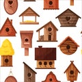 Seamless pattern of different wooden handmade bird houses isolated on white background. Cartoon homemade nesting boxes