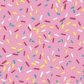 Seamless pattern donut with pink glaze. Background with decorative colored sprinkles. Royalty Free Stock Photo