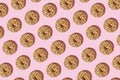 Seamless pattern of donuts with chocolate over it against pink pastel background Royalty Free Stock Photo