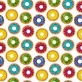 Seamless pattern of donuts multi colored on a white isolated background. Confectionery sweets top view.