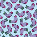 Seamless pattern with doodle warm socks with different texture and color. Vector winter hand drawn socks. Christmas and