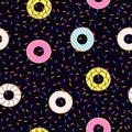 Seamless pattern of doughnuts with colored icing. Trendy beautiful donuts Black background