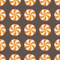 Seamless pattern with drawn traditional round halloween candy drops with orange and white swirls