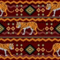 Seamless pattern in ethnic style northern tiger on the background of patterns. Royalty Free Stock Photo