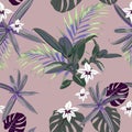 Seamless pattern with exotic tropical palms. Green, violet tropical plants on the pink background. Royalty Free Stock Photo