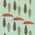 Seamless pattern of feathers on a green background Royalty Free Stock Photo