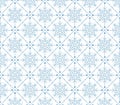 Seamless pattern featuring blue snowflakes within a geometric network of diamond shapes. Royalty Free Stock Photo