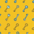 Seamless pattern featuring light blue vintage keys on a bright yellow background. The Royalty Free Stock Photo