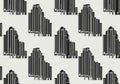 Seamless pattern featuring stylized, black and white Art Deco skyscraper designs. Each building Royalty Free Stock Photo