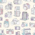 Seamless pattern with film and digital photographic or photo cameras on light background. Photography backdrop. Hand