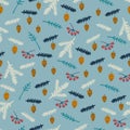 Seamless pattern with fir-tree branches, berries, strobiles, oak acorns on blue background Royalty Free Stock Photo