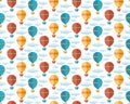 Seamless pattern in flat vector. Yellow, blue and red air balloon, aerostat flying in the sky among the clouds. Travel by air. Fun Royalty Free Stock Photo