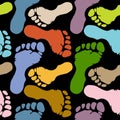 Seamless pattern of footprints in pastel colors on dark background Royalty Free Stock Photo