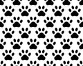 seamless pattern footprints. white background. cute black and gray animal tracks. vector texture. Royalty Free Stock Photo