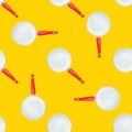 Seamless pattern from frying pans with white ceramic coating red handle on yellow background. Food culinary pattern