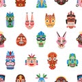Seamless pattern of funny ethnic tribal masks isolated on white background. Ancient African bright colorful ritual