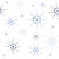 Seamless pattern of geometric different blue tones snowflakes different sizes on white background. Flat style winter holiday and Royalty Free Stock Photo