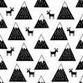 Seamless pattern with geometric snowy mountains and reindeers. Cute winter mountains background.