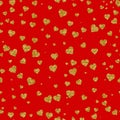 Seamless pattern from gloving gold hearts on a red background. Valentine`s day Royalty Free Stock Photo