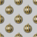 Seamless pattern with gold and silver Christmas balls on a grey background Royalty Free Stock Photo