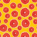 Seamless pattern of grapefruit in cross section. Pink juicy grapefruit halves on yellow background. Top view