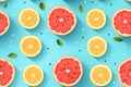 seamless pattern of grapefruit slices and slices on blue background Royalty Free Stock Photo