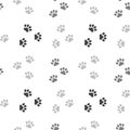 Seamless pattern, gray paw prints on a white background. Children\'s textiles, print, kids bedroom decor Royalty Free Stock Photo