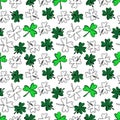 Seamless pattern with green clover isolated on white background. Hand drawn vector silhouette sketch illustration in doodle Royalty Free Stock Photo