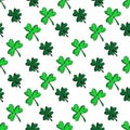 Seamless pattern with green clover isolated on white background. Hand drawn vector silhouette sketch illustration in Royalty Free Stock Photo
