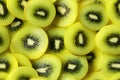seamless pattern with green kiwi slices on yellow background Royalty Free Stock Photo