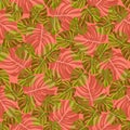 Seamless pattern of green and red-orange tropical leaves of Monstera, on a coral background Royalty Free Stock Photo