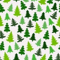 Seamless pattern with green silhouettes of fir-trees and pines. Winter forest background. Scrapbook digital paper